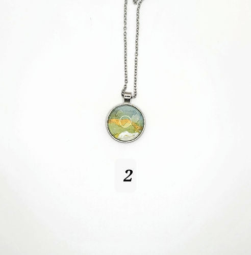 hand-painted acrylic abstract design with gold, green, and white swirls
